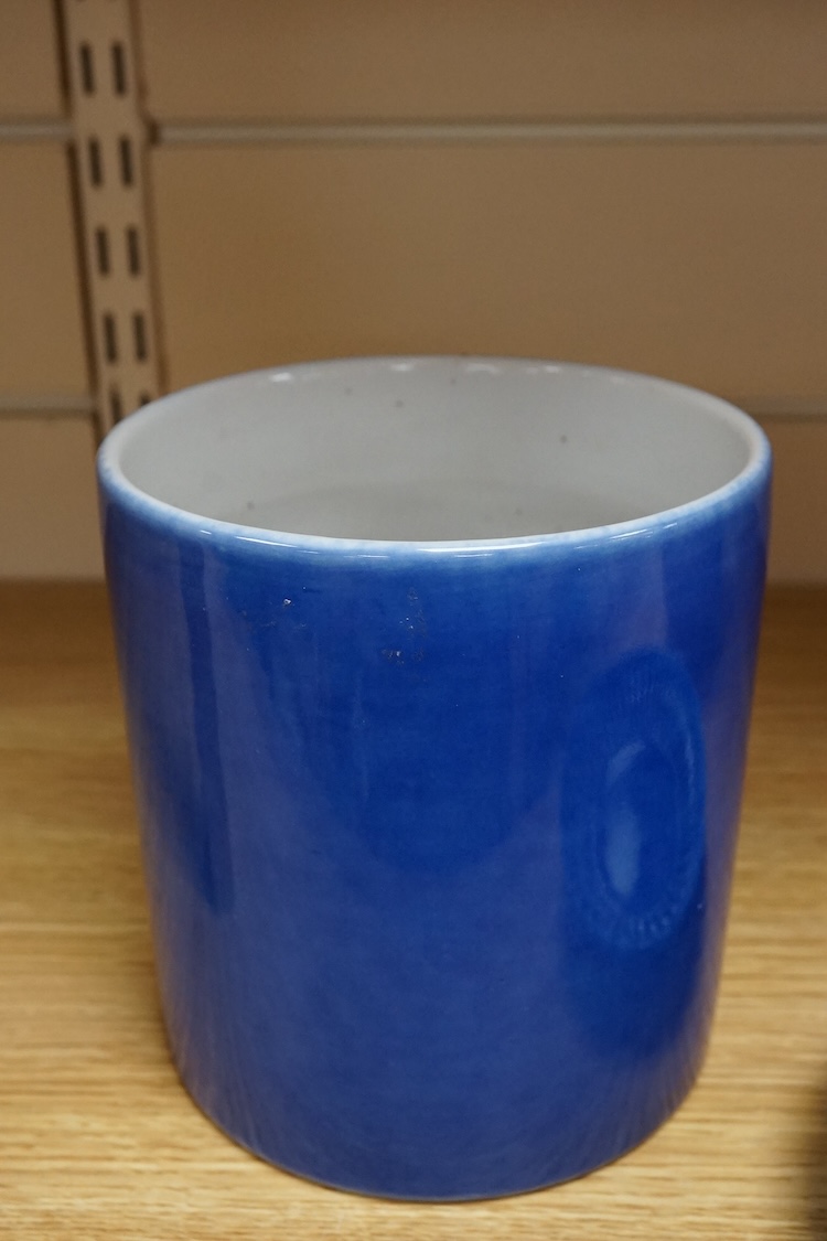 A Chinese blue glazed cylindrical brush pot, Kangxi mark but later, a similar saucer, Qianlong mark but later and a terracotta jug, 21cm